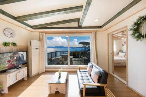 Superior Apartment, 1 Bedroom, Sea View | Living area | Flat-screen TV, heated floors