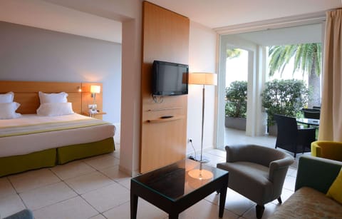 Suite, Sea View | Minibar, in-room safe, desk, blackout drapes