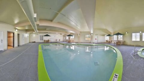 Indoor pool, open 7:00 AM to 10:00 PM, pool umbrellas, sun loungers
