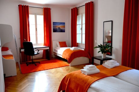 Family Quadruple Room, 1 Bedroom, Shared Bathroom | Desk, blackout drapes, free WiFi, bed sheets