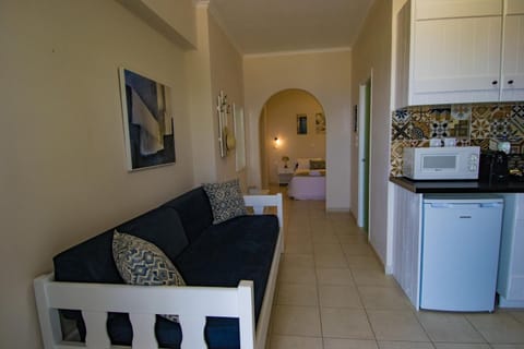 Apartment, Sea View | Living area | Flat-screen TV