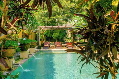 Outdoor pool, open 7:00 AM to 10:00 PM, pool umbrellas, sun loungers