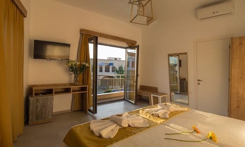 Family Apartment, 1 Bedroom, Partial Sea View | Premium bedding, down comforters, in-room safe, blackout drapes