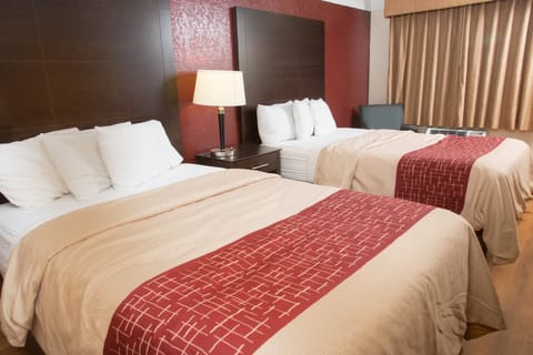 Desk, blackout drapes, iron/ironing board, free cribs/infant beds