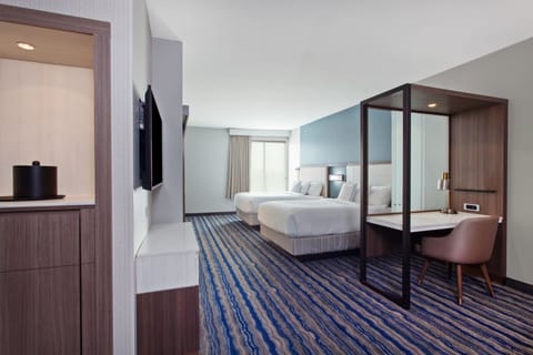 Hypo-allergenic bedding, desk, laptop workspace, blackout drapes