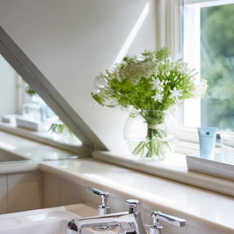 Designer toiletries, hair dryer, bathrobes, slippers