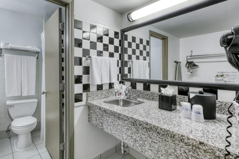 Standard Room, 2 Double Beds, Non Smoking (Larger Room) | Bathroom | Hair dryer, towels, soap, shampoo