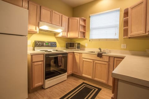 Suite, 1 King Bed with Sofa bed | Private kitchen | Fridge, microwave, coffee/tea maker