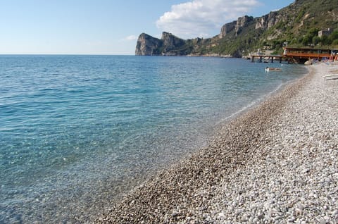 On the beach, sun loungers, beach umbrellas, beach bar