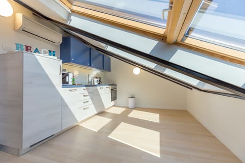 Loft Apartment | Private kitchen | Fridge, microwave, oven, stovetop