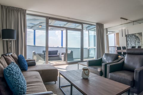 Suite, 1 King Bed (Penthouse) | Living area | 32-inch flat-screen TV with cable channels, TV