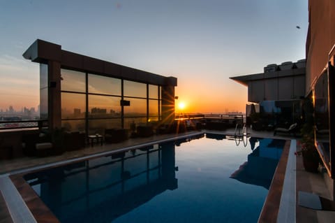 Outdoor pool, open 7:00 AM to 6:30 PM, pool umbrellas, sun loungers