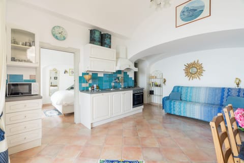 Panoramic Apartment, 2 Bedrooms, Jetted Tub, Sea View (L'Infinito) | Living area | Flat-screen TV