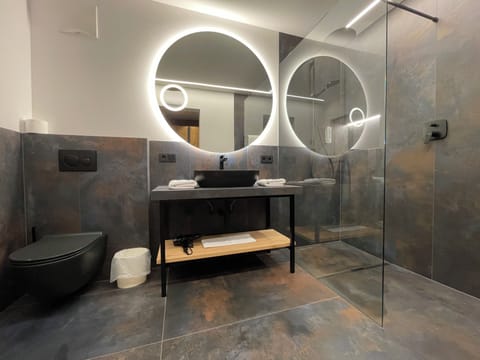 Glacier Suite | Bathroom | Hair dryer, bathrobes, towels, soap