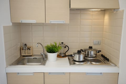 Fridge, cookware/dishes/utensils, dining tables