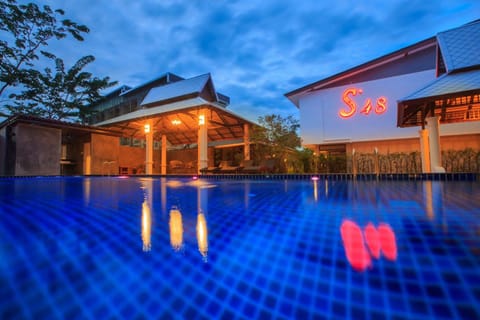 Outdoor pool, open 6:00 AM to 10:00 PM, free cabanas, pool umbrellas