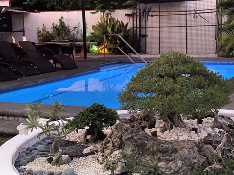 Outdoor pool, open 9:00 AM to midnight, pool umbrellas, sun loungers