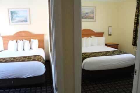 Deluxe Family Suite with 3 Queen Beds & Kitchenette, Non Smoking | Desk, iron/ironing board, free WiFi, bed sheets