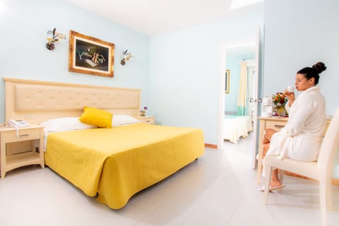 Superior Quadruple Room | Minibar, in-room safe, desk, iron/ironing board