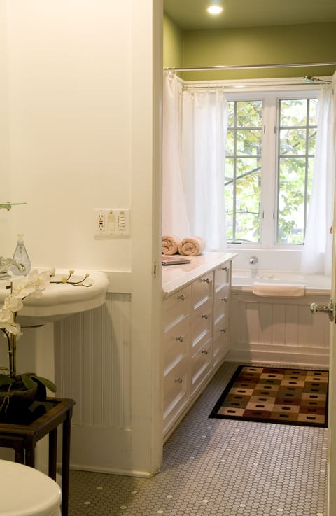 Carriage House | Bathroom | Eco-friendly toiletries, hair dryer, bathrobes, heated floors
