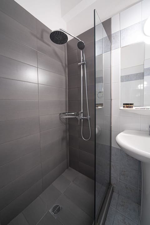 Shower, free toiletries, hair dryer, slippers