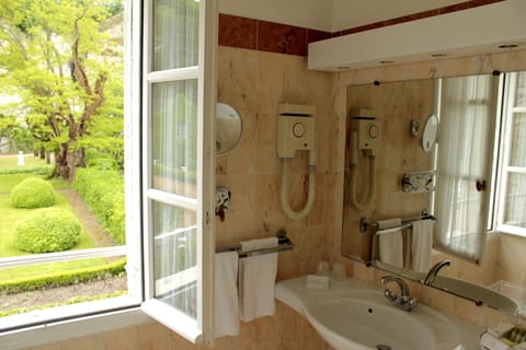 Combined shower/tub, designer toiletries, hair dryer, bathrobes