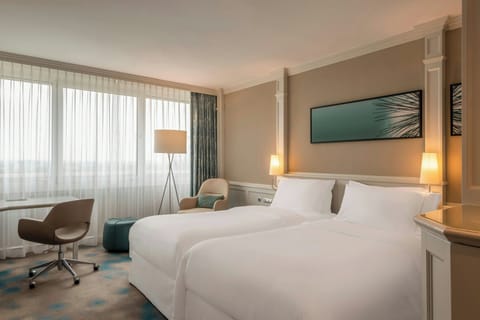 Hypo-allergenic bedding, down comforters, pillowtop beds, minibar