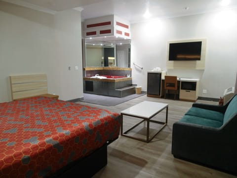 Room, 1 King Bed, Jetted Tub | Iron/ironing board, alarm clocks