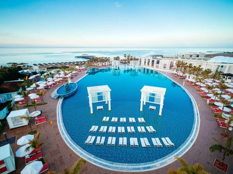 Indoor pool, 2 outdoor pools, open 8:00 AM to 7:00 PM, pool umbrellas