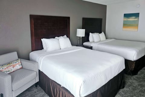 Premium bedding, desk, laptop workspace, blackout drapes