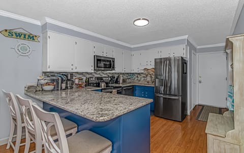 Condo, 2 Bedrooms, Oceanfront (E1) | Private kitchen | Toaster, cookware/dishes/utensils, dining tables