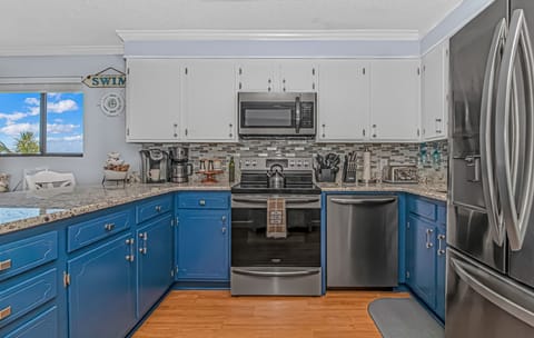 Condo, 2 Bedrooms, Oceanfront (E1) | Private kitchen | Toaster, cookware/dishes/utensils, dining tables