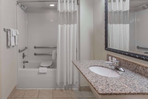 Shower, designer toiletries, hair dryer, towels