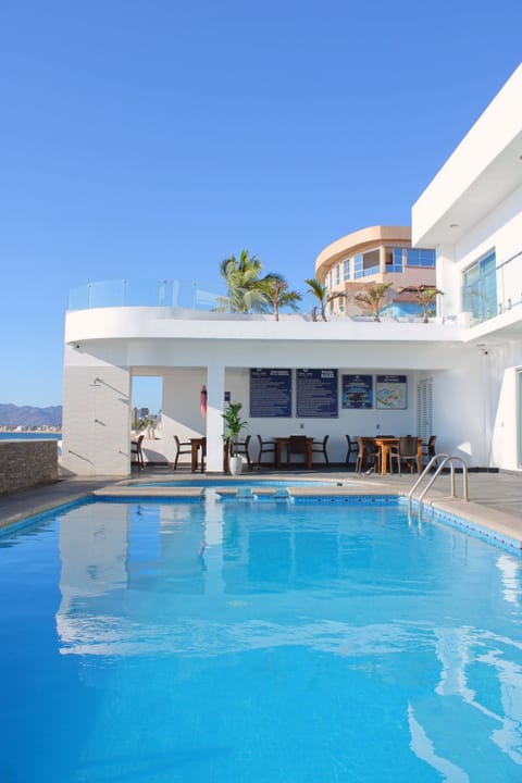 Outdoor pool, open 10:00 AM to 10:00 PM, pool umbrellas, sun loungers