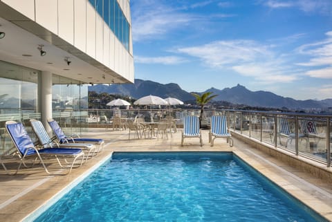 Outdoor pool, pool umbrellas, sun loungers