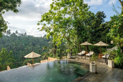 Outdoor pool, open 7:00 AM to 10:00 PM, pool umbrellas, sun loungers