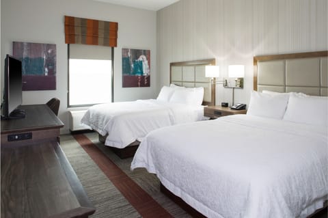 Hypo-allergenic bedding, desk, laptop workspace, blackout drapes