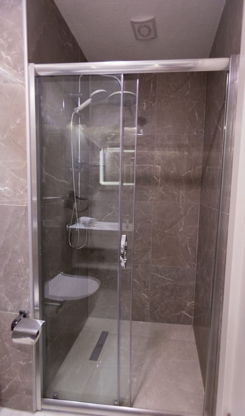 Shower, free toiletries, hair dryer, slippers