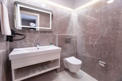 Shower, free toiletries, hair dryer, slippers