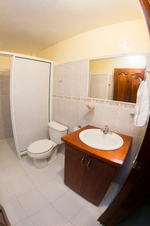 Room, 2 Double Beds | Bathroom | Shower, free toiletries, hair dryer, towels