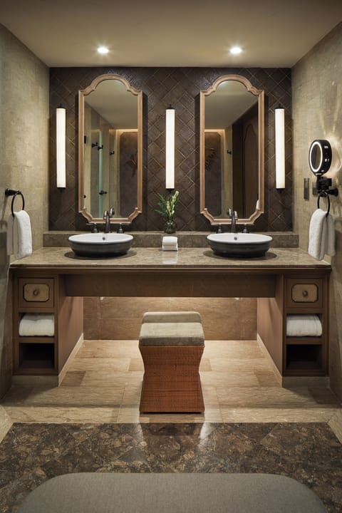 Designer toiletries, hair dryer, bathrobes, slippers