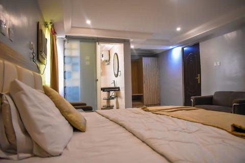 Desk, laptop workspace, bed sheets