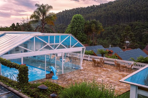 Indoor pool, open 9:00 AM to 6:00 PM, pool umbrellas, sun loungers