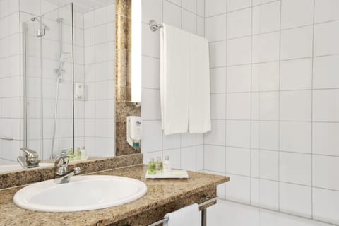 Eco-friendly toiletries, hair dryer, slippers, towels