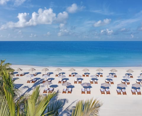 Private beach, white sand, beach umbrellas, beach towels