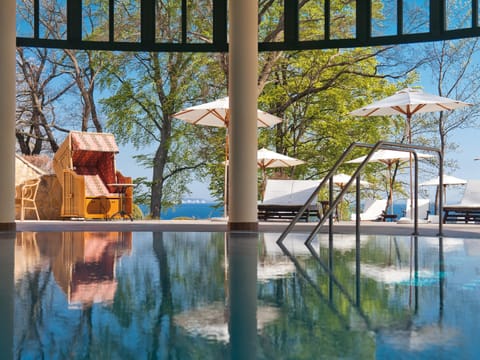 Indoor pool, open 7:00 AM to 10:00 PM, sun loungers