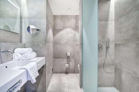 Designer toiletries, hair dryer, bathrobes, slippers