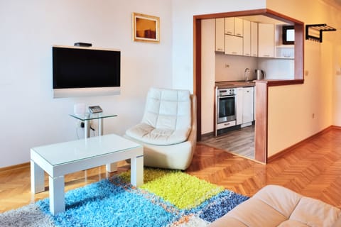 Apartment, 1 Bedroom - Annex building | Living area | Flat-screen TV, books