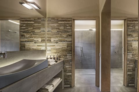 Designer toiletries, hair dryer, bathrobes, slippers