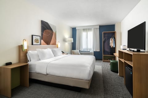 Hypo-allergenic bedding, desk, laptop workspace, blackout drapes